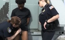 Two White Female Cops Handling Black Shaft On Top Of Roof