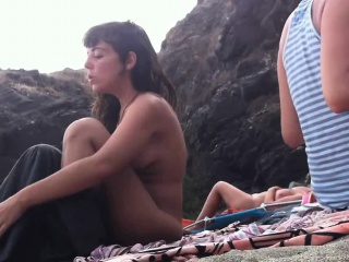 Several sexy nude girls caught on a beach with a spy cam