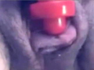 a woman pumps her clit into a dick